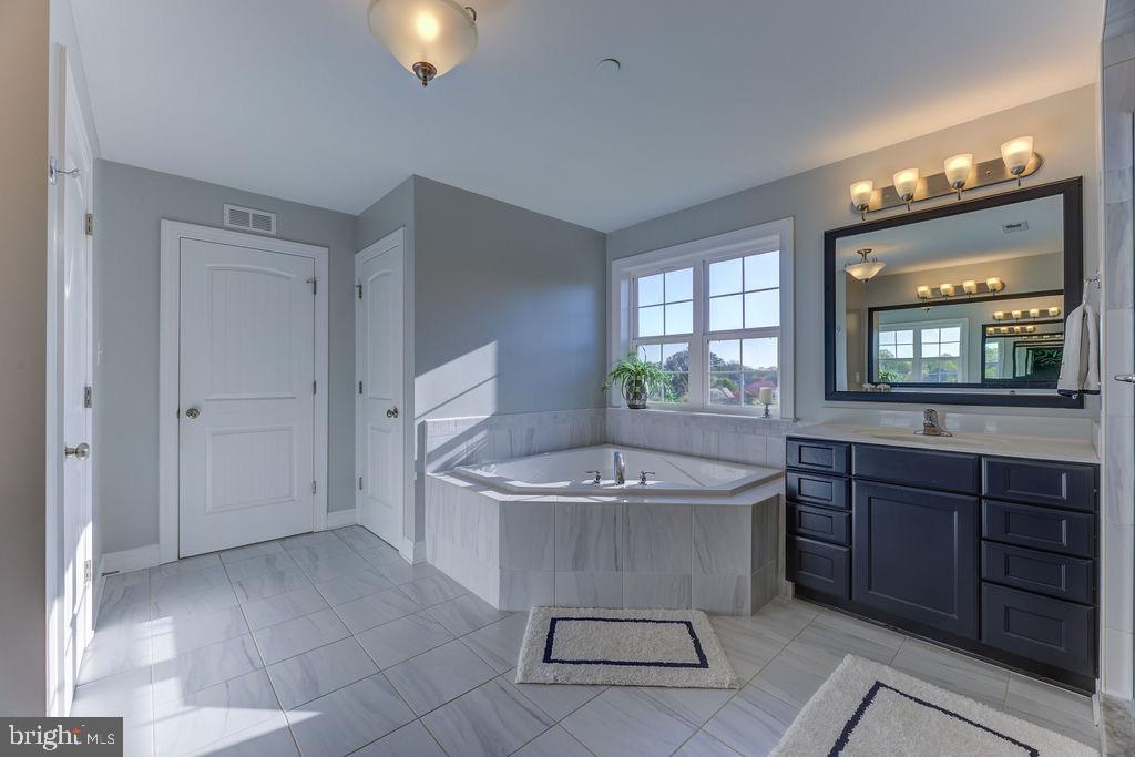 600 Ray Road Sunderland, MD 20689 - Photo 15 of 25 a room with a sink and a mirror