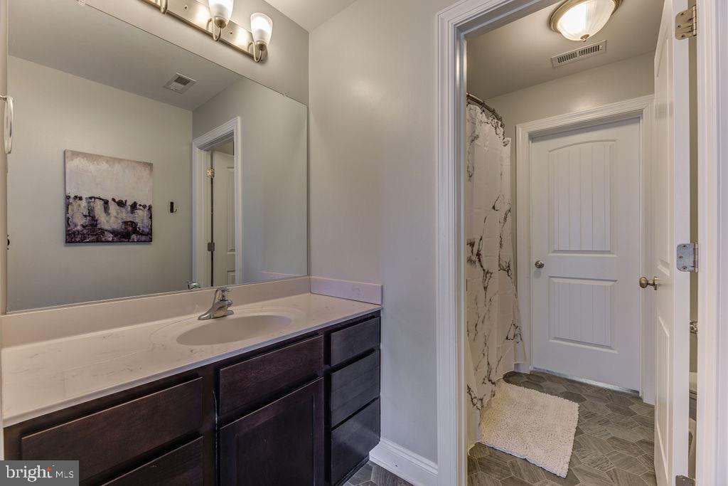 600 Ray Road Sunderland, MD 20689 - Photo 18 of 25 a bathroom with a sink and a mirror