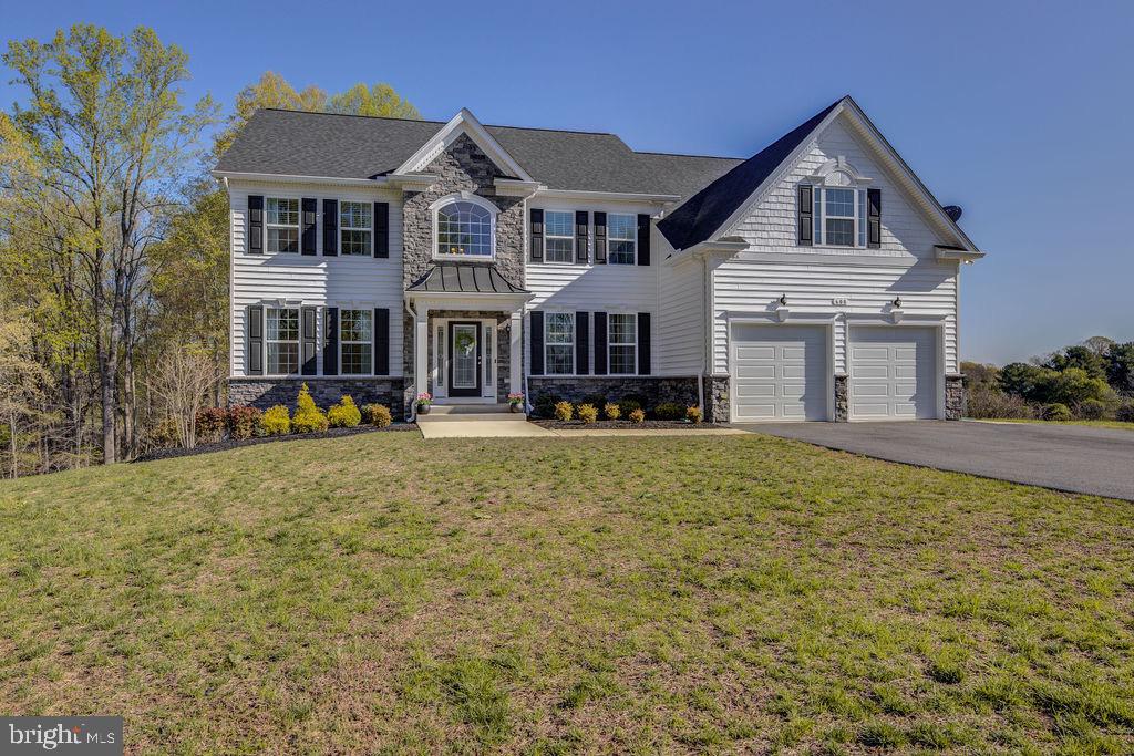 600 Ray Road Sunderland, MD 20689 - Photo 21 of 25 a front view of a house with a yard