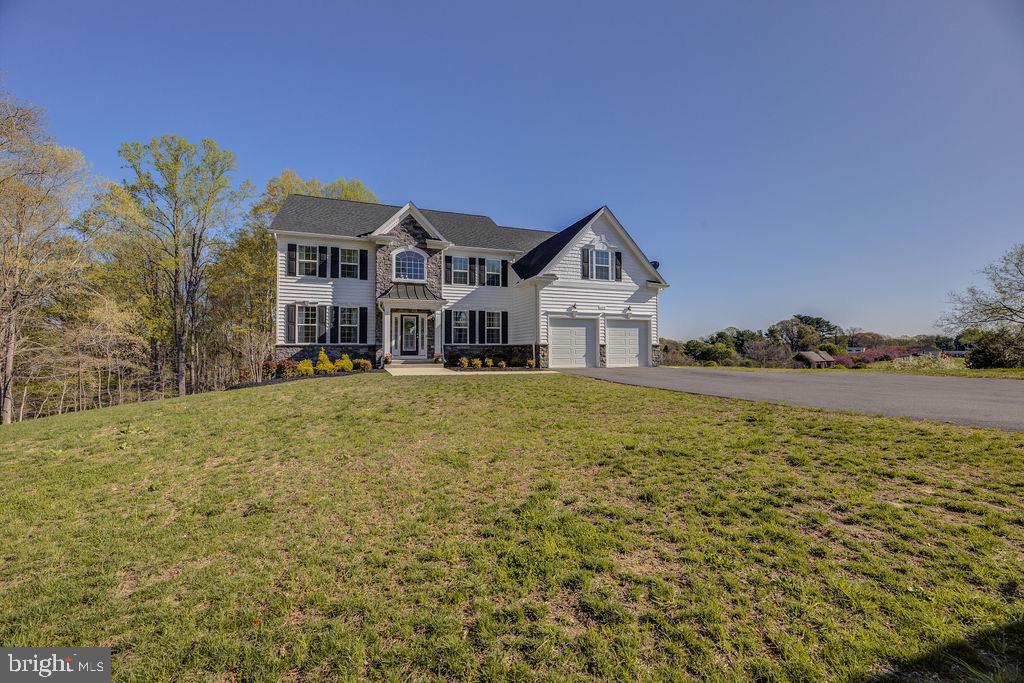 600 Ray Road Sunderland, MD 20689 - Photo 22 of 25 a front view of a house with a yard