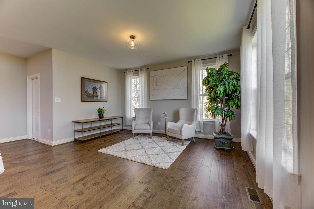 600 Ray Road Sunderland, MD 20689 - Photo 8 of 25 a living room with furniture and a wooden floor