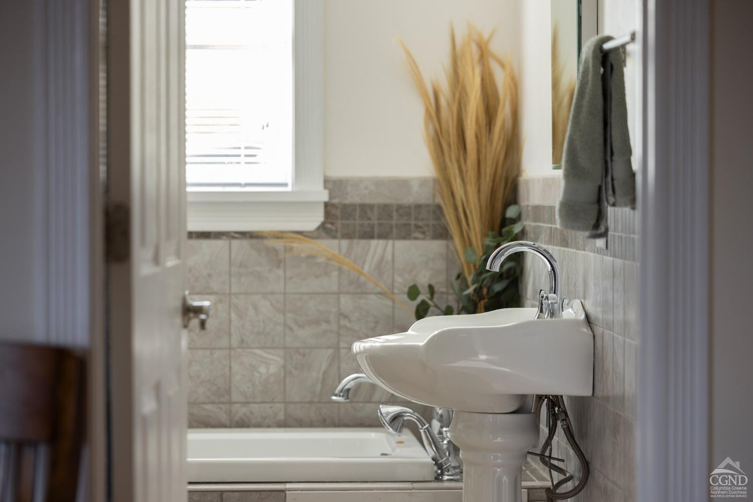 5289 Co Rte 20 Durham, NY 12422 - Photo 20 of 59 a bathroom with a sink a toilet and a window