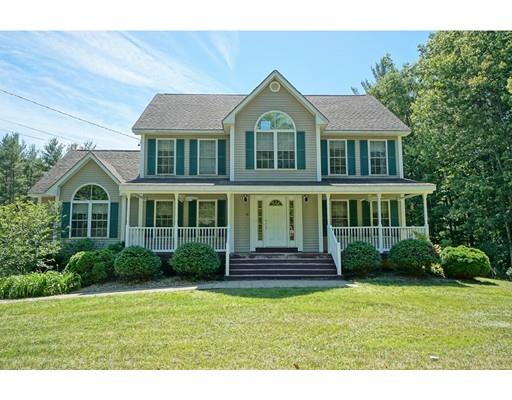 93 Patten Hill Road Candia, NH 03034 - Photo 1 of 40 a front view of a house with a garden