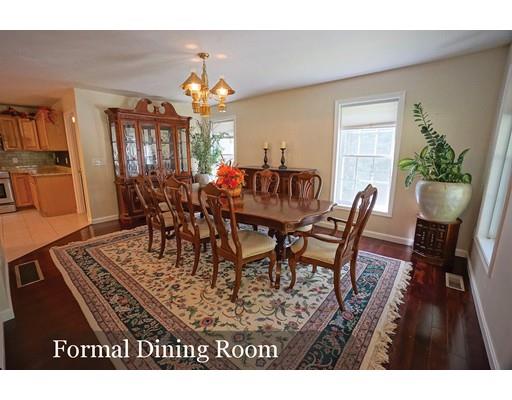 93 Patten Hill Road Candia, NH 03034 - Photo 11 of 40 a view of a dining room with furniture and a chandelier