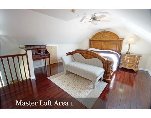 93 Patten Hill Road Candia, NH 03034 - Photo 27 of 40 a bedroom with a bed and wooden floor