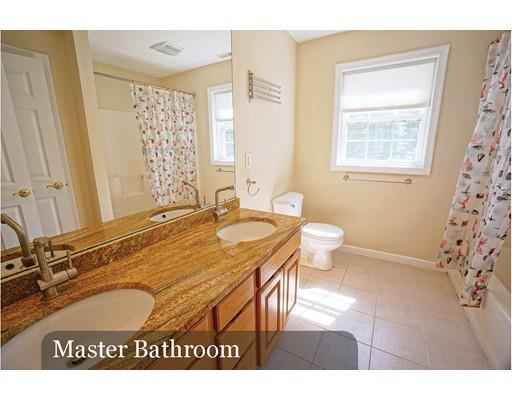 93 Patten Hill Road Candia, NH 03034 - Photo 29 of 40 a bathroom with a granite countertop sink a toilet a mirror and shower