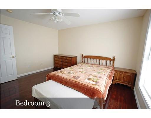93 Patten Hill Road Candia, NH 03034 - Photo 33 of 40 a bedroom with a bed and wooden floor
