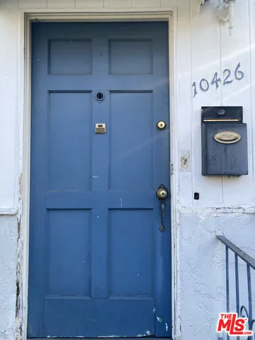 a bathroom with a mirror and a shower