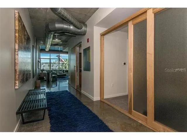 a kitchen with stainless steel appliances a stove a sink and a microwave