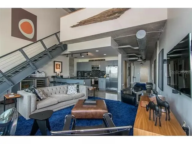 a large bathroom with a granite countertop sink mirror and shower