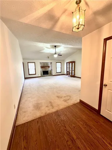 a view of livingroom with hardwood floor and hallway