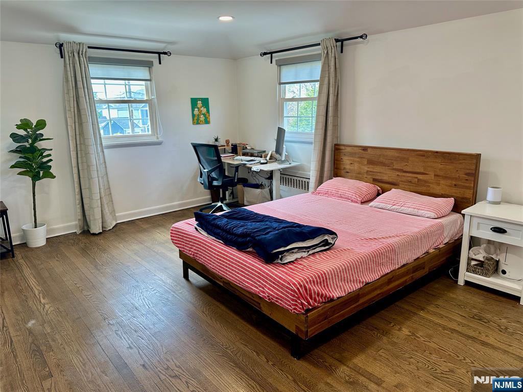 440 Bogert Road River Edge, NJ 07661 - Photo 20 of 25 a bedroom with a bed and wooden floor