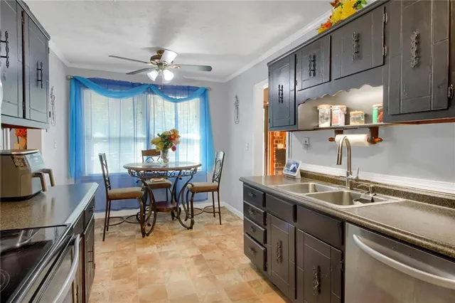a kitchen with a dining table and chairs