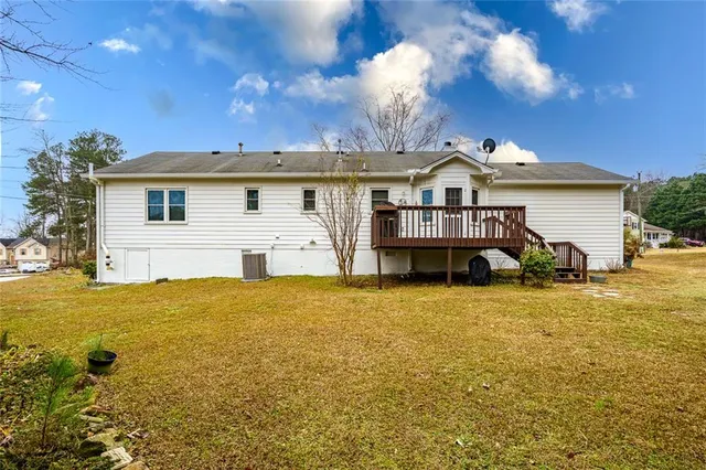 a view of a house with a yard and garage