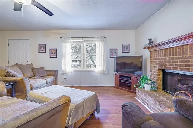 a spacious bedroom with a bed and a flat screen tv