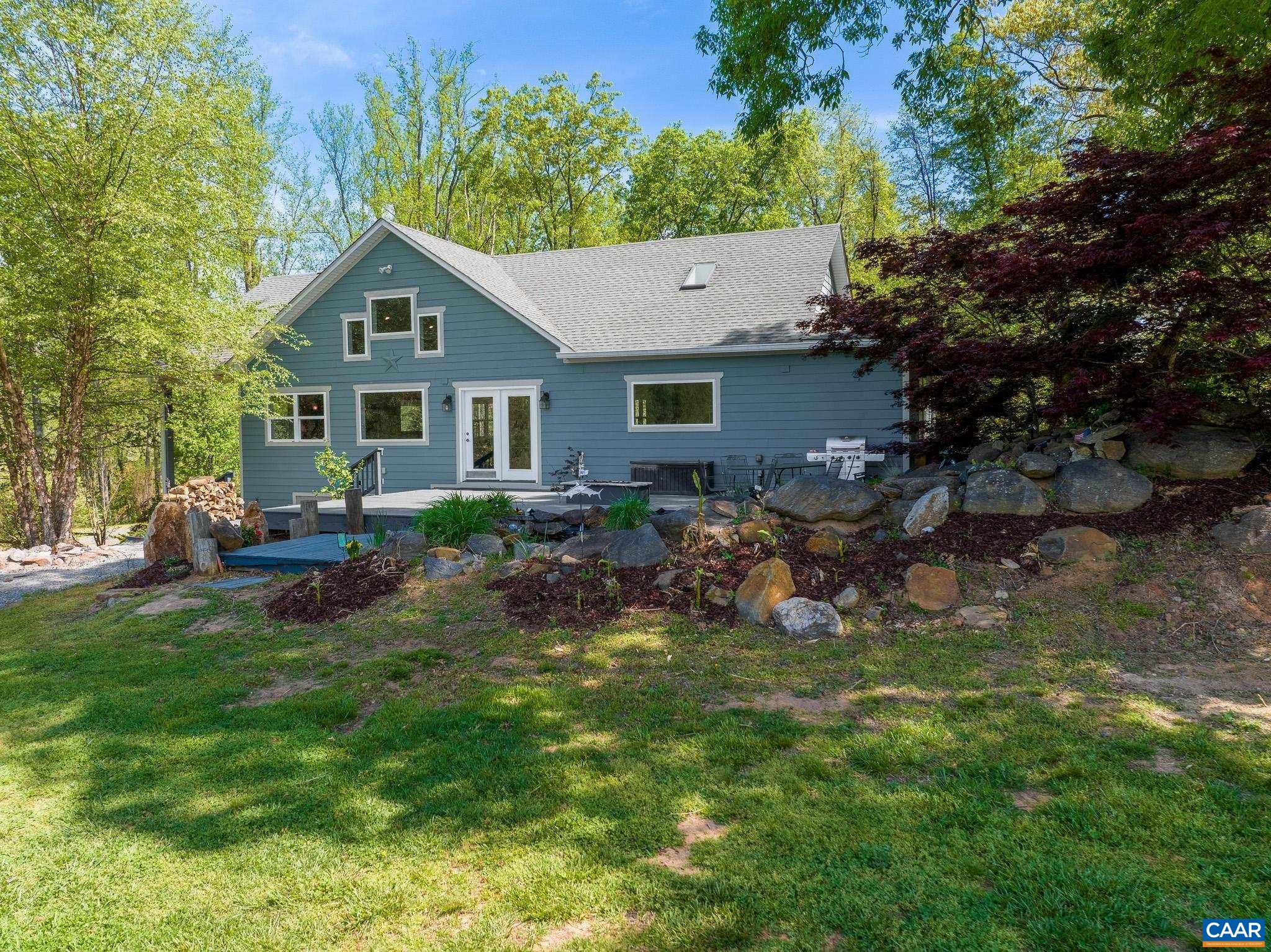 1671 Dudley Mountain Road Charlottesville, VA 22903 - Photo 59 of 60 a view of a house with a yard and sitting area
