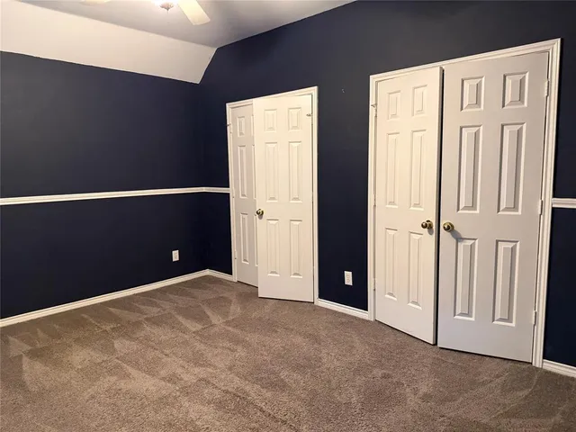 a view of an empty room with windows