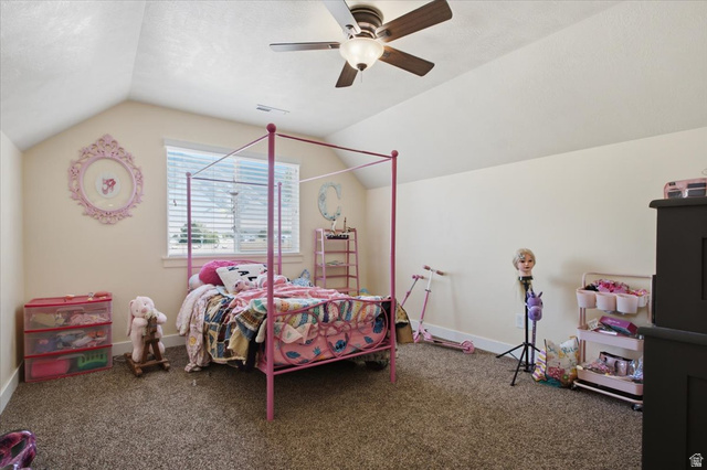 1232 Canyon Road Tooele, UT 84074 - Photo 32 of 54 Room featuring vaulted ceilings, a ceiling fan with light fixture, neutral wall paint, and carpet flooring
