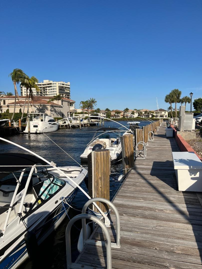 899 Jeffery Street, Unit 703 Boca Raton, FL 33487 - Photo 14 of 22 a view of a balcony with chairs