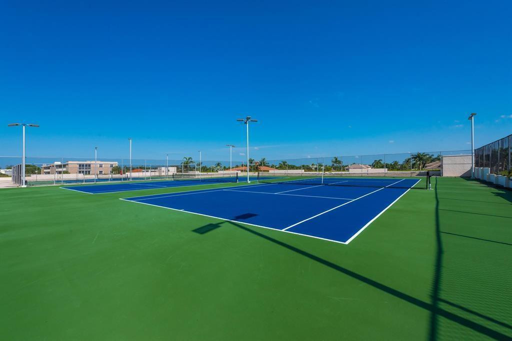 899 Jeffery Street, Unit 703 Boca Raton, FL 33487 - Photo 17 of 22 a view of tennis court with chairs