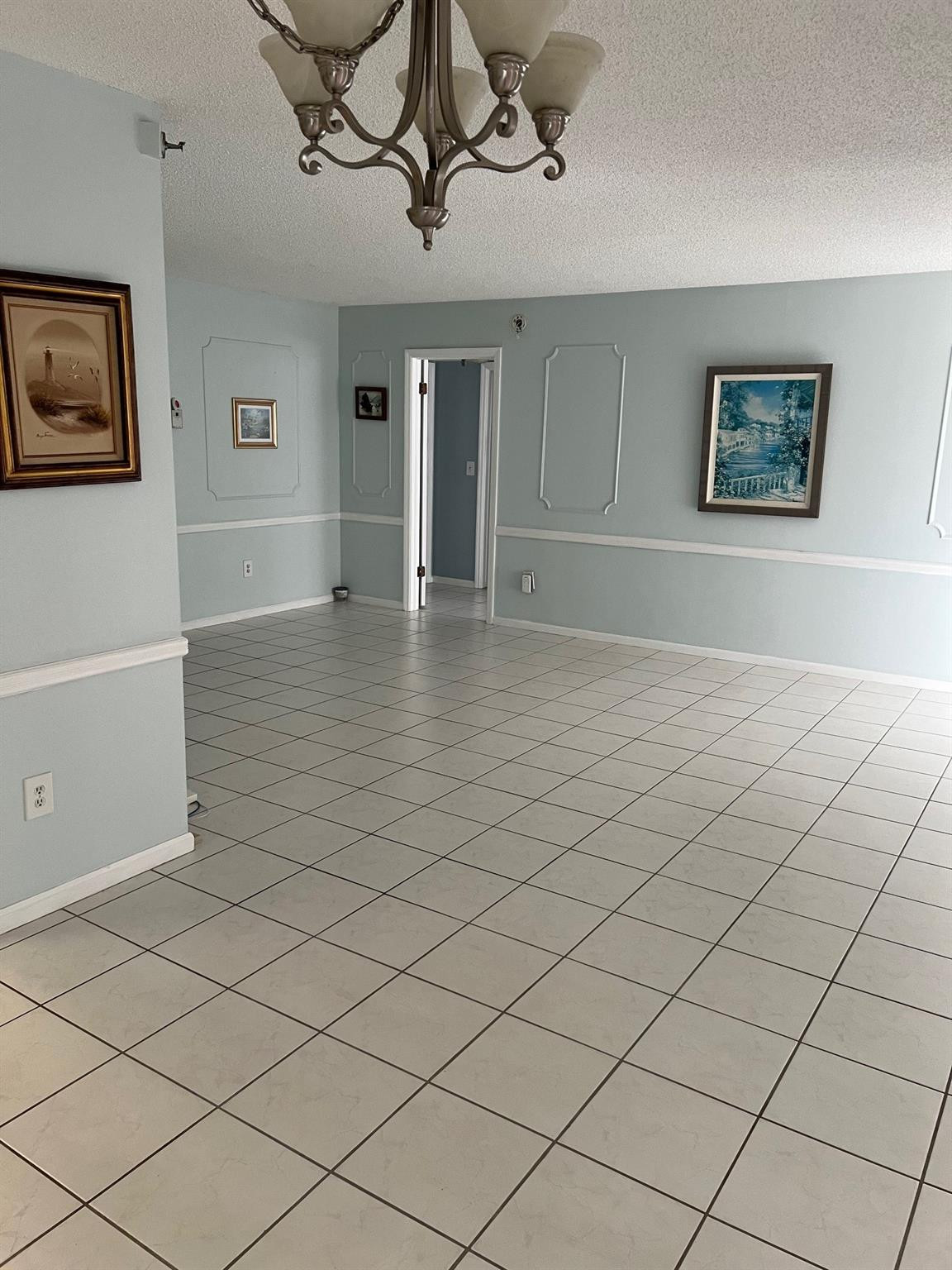 899 Jeffery Street, Unit 703 Boca Raton, FL 33487 - Photo 2 of 22 a view of a livingroom with wooden floor and furniture
