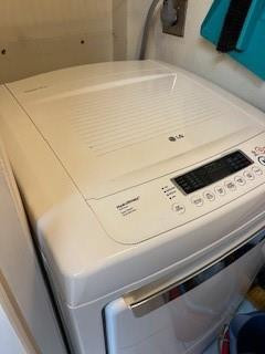 899 Jeffery Street, Unit 703 Boca Raton, FL 33487 - Photo 21 of 22 a close up view of washer and dryer