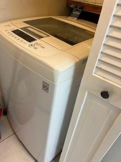 899 Jeffery Street, Unit 703 Boca Raton, FL 33487 - Photo 22 of 22 a utility room with washer and dryer