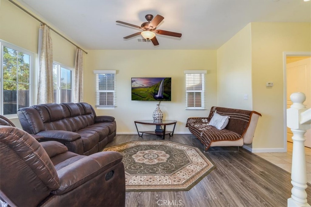 1213 Meridian Way Lompoc, CA 93436 - Photo 13 of 37 a living room with furniture a fireplace and a flat screen tv