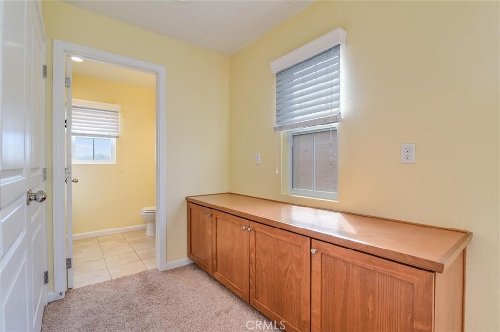 1213 Meridian Way Lompoc, CA 93436 - Photo 18 of 37 a room with cabinets and wooden floor