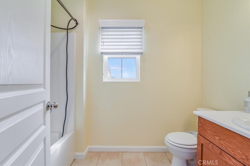 1213 Meridian Way Lompoc, CA 93436 - Photo 19 of 37 a bathroom with a granite countertop toilet and a sink