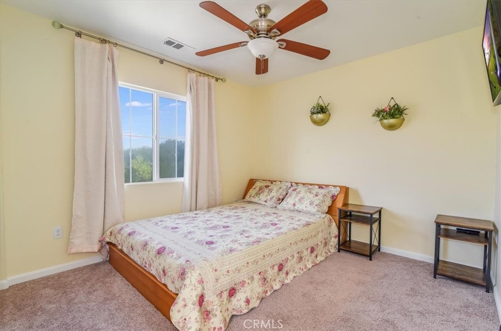 1213 Meridian Way Lompoc, CA 93436 - Photo 25 of 37 a bedroom with a bed and a window