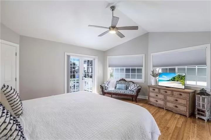 437 Trade Winds Avenue Naples, FL 34108 - Photo 17 of 33 a spacious bedroom with a bed and a dresser