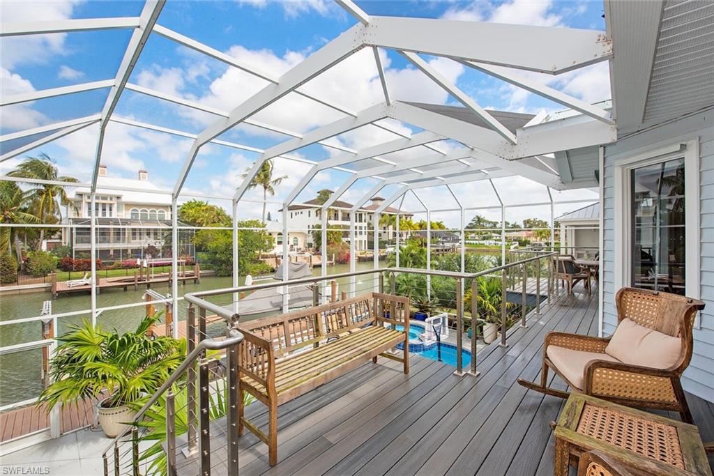 437 Trade Winds Avenue Naples, FL 34108 - Photo 26 of 33 a view of a chairs in the balcony