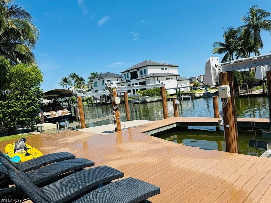 437 Trade Winds Avenue Naples, FL 34108 - Photo 32 of 33 a view of a swimming pool with outdoor seating