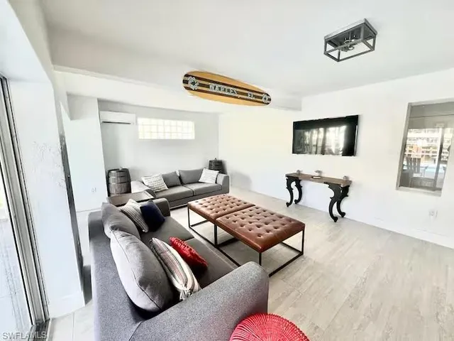 a living room with furniture and a flat screen tv
