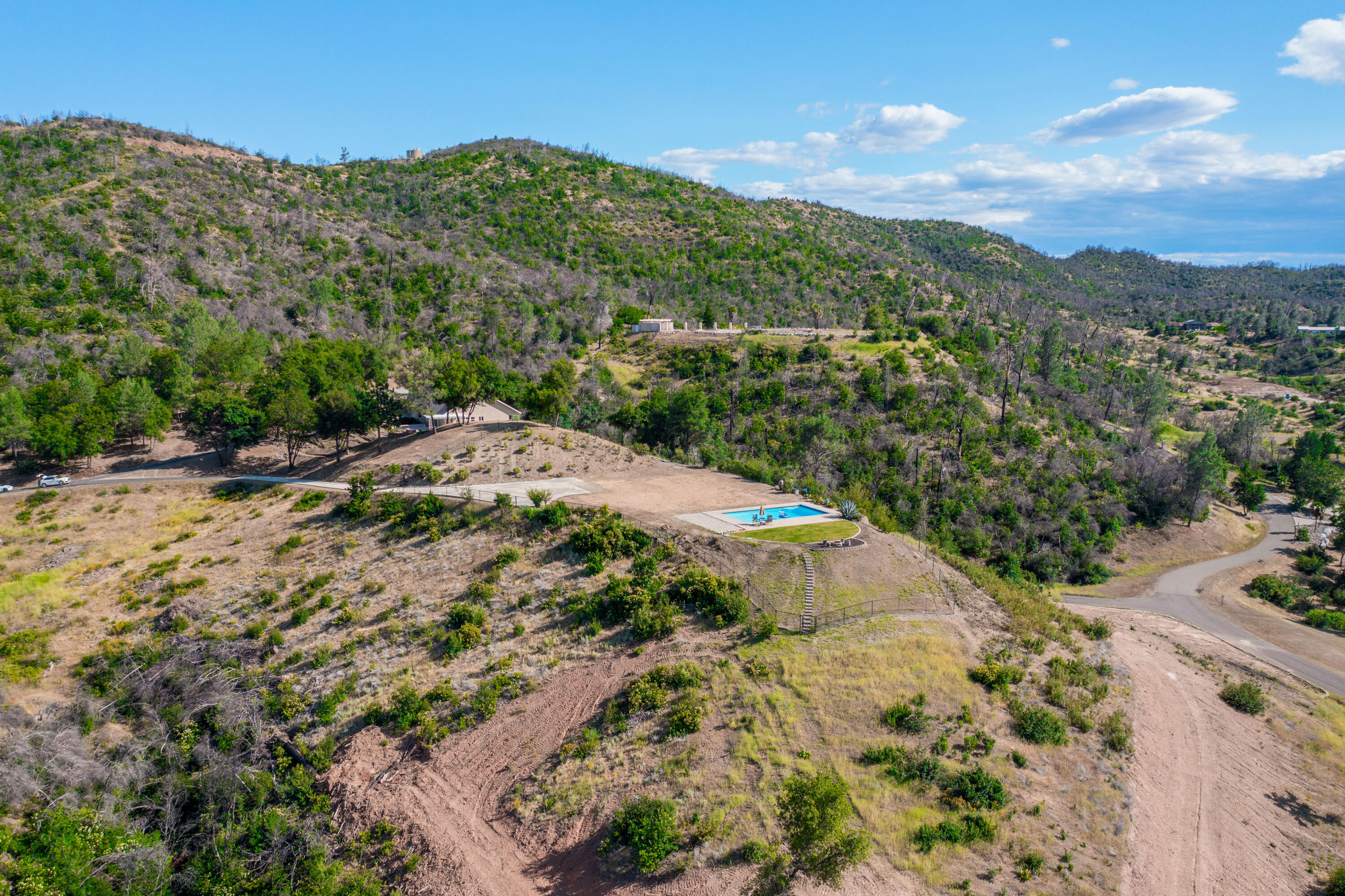 16275 Valparaiso Way Redding, CA 96001 - Photo 11 of 13 a view of a field with mountains in the background