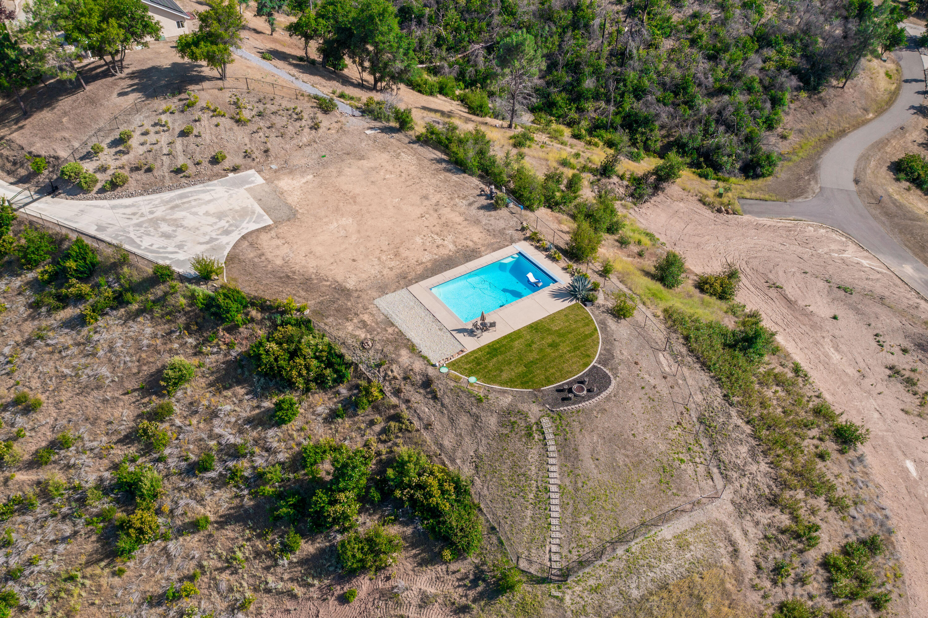16275 Valparaiso Way Redding, CA 96001 - Photo 13 of 13 a view of a swimming pool with a yard