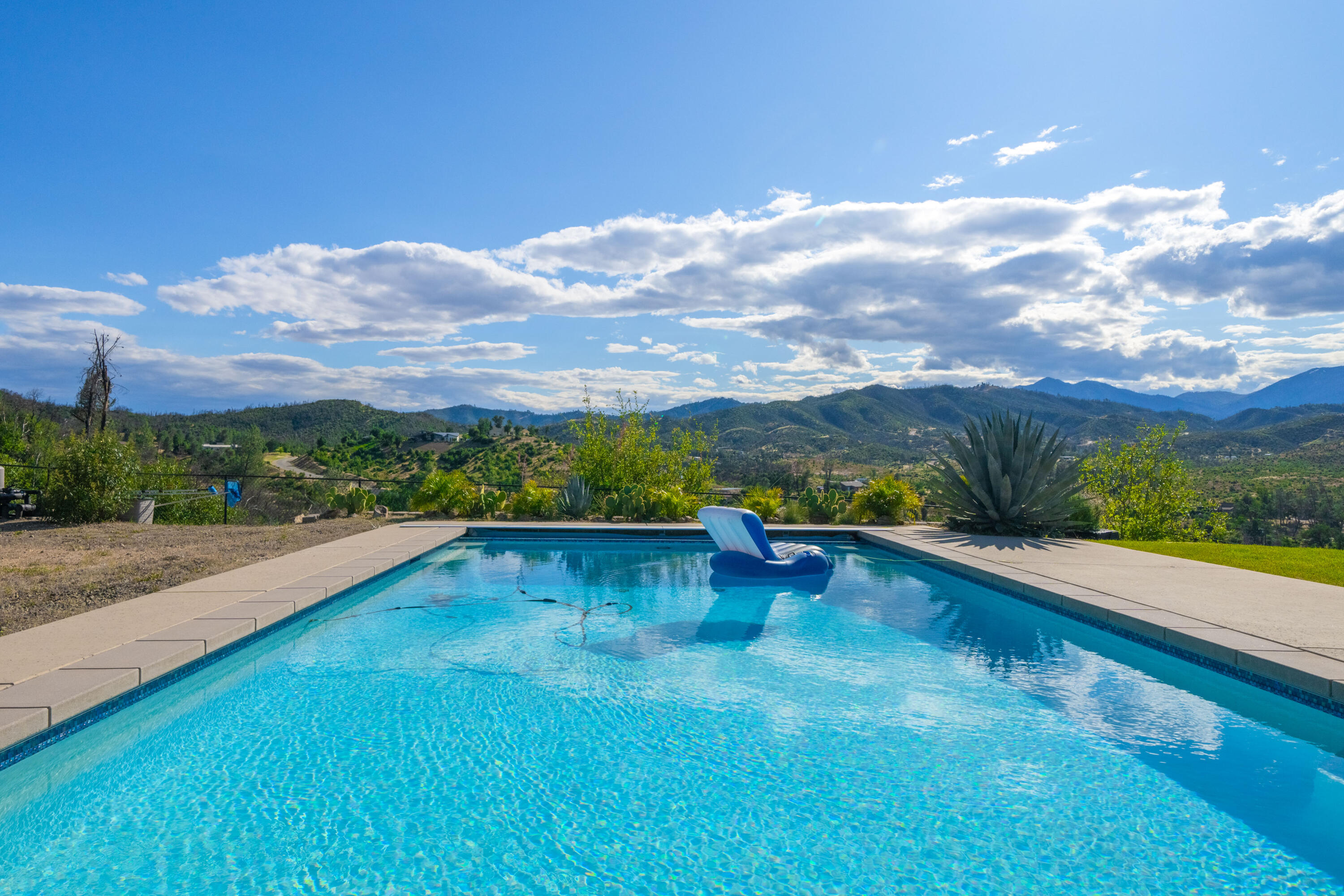 16275 Valparaiso Way Redding, CA 96001 - Photo 2 of 13 a view of swimming pool with lounge chair