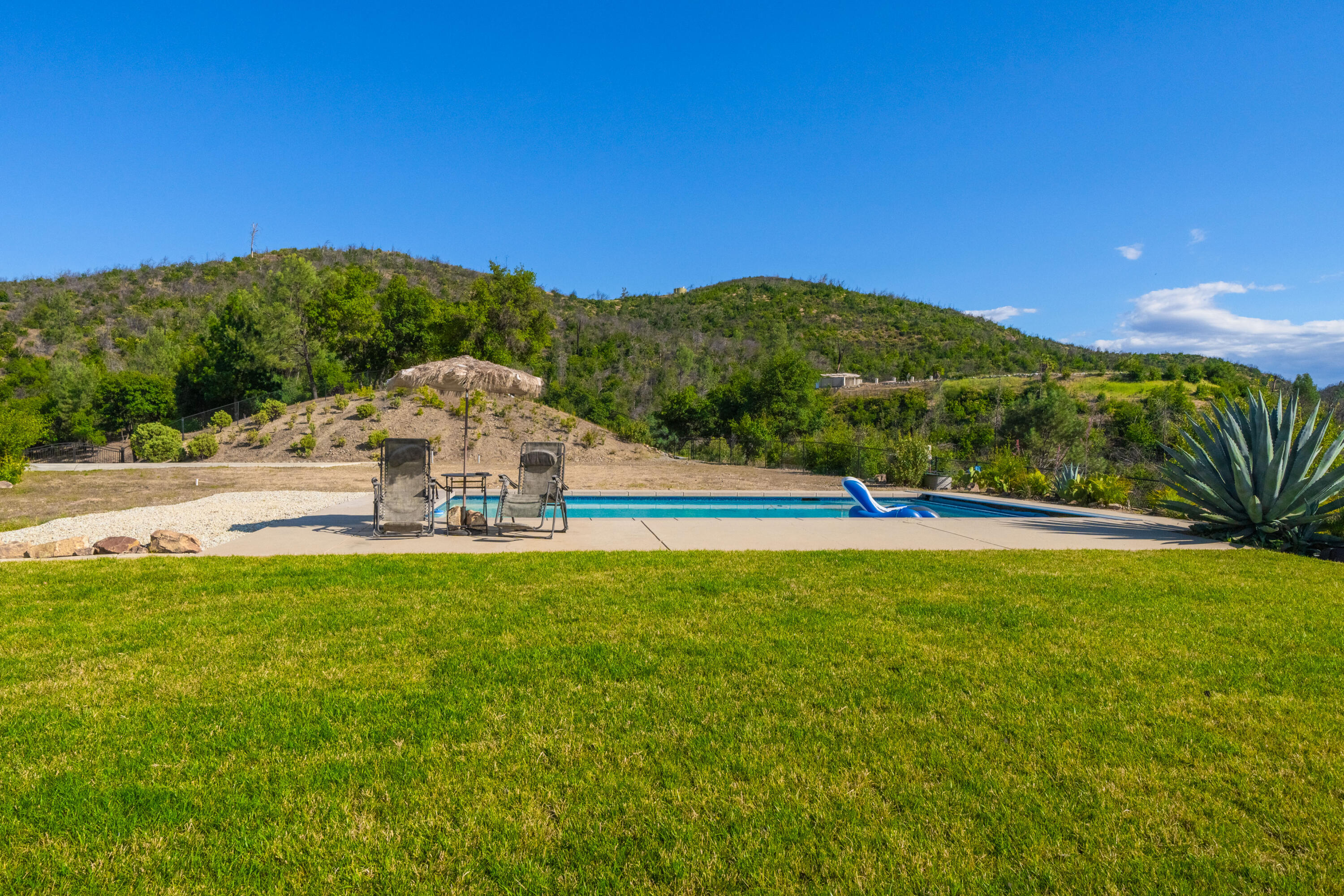 16275 Valparaiso Way Redding, CA 96001 - Photo 6 of 13 a view of a lake with a houses in the background