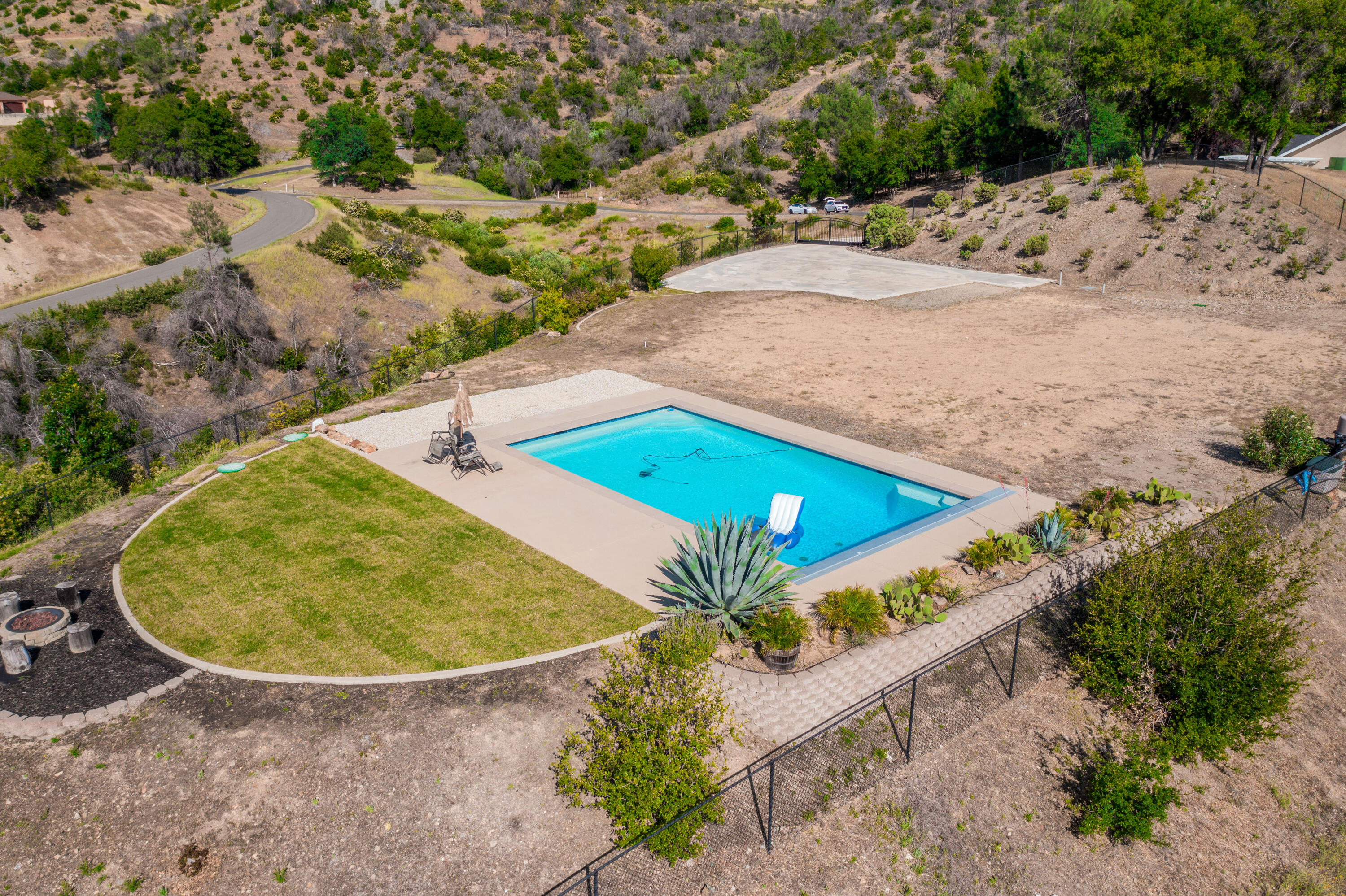 16275 Valparaiso Way Redding, CA 96001 - Photo 7 of 13 an aerial view of a house with a swimming pool