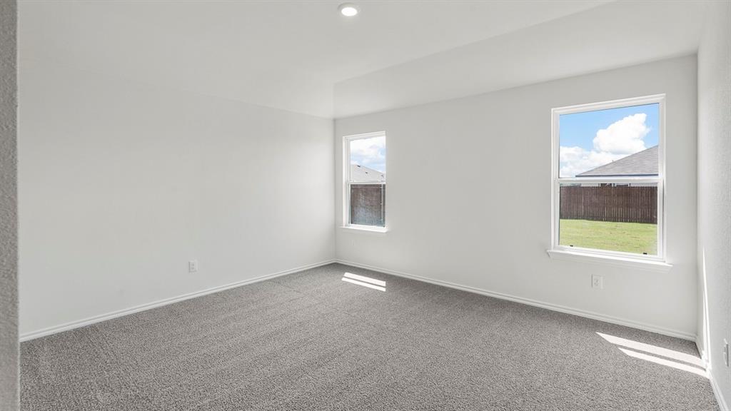 1675 Mantle Road Crandall, TX 75114 - Photo 13 of 27 Spacious room featuring neutral carpeting and white painted walls