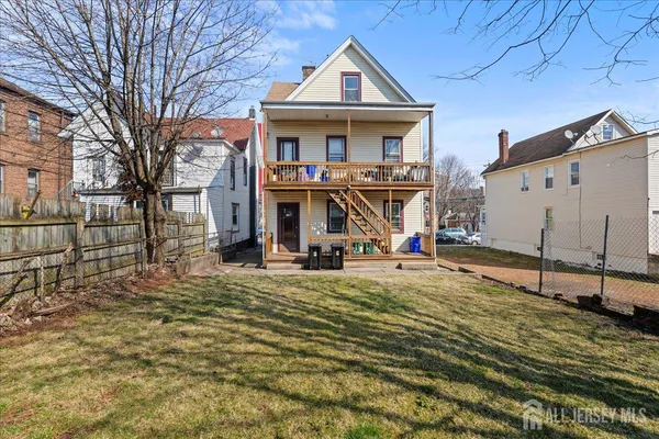 a view of a dining room with furniture and a window
