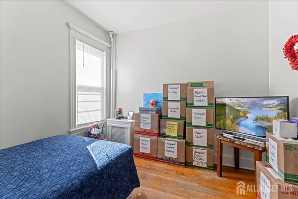 a kitchen with stainless steel appliances granite countertop a refrigerator a stove a dining table and chairs