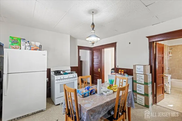 a view of a room with workspace and a window