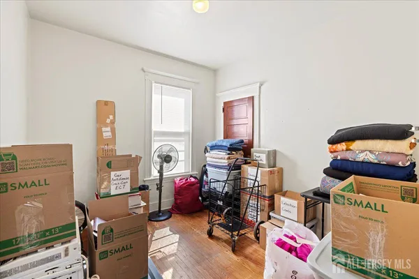a dining room with furniture a chandelier and window
