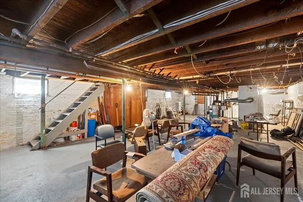a bedroom with two beds and a flat screen tv