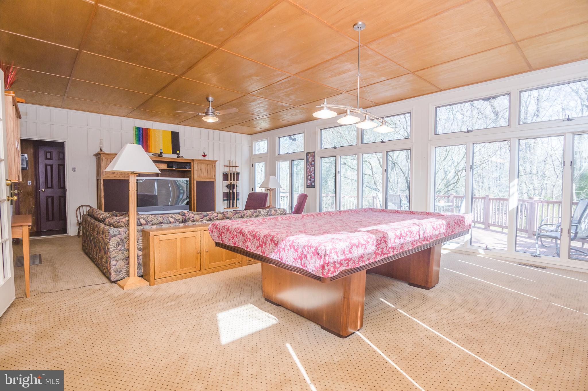 3387 Allen Road Eden, MD 21822 - Photo 14 of 67 a spacious bedroom with a large bed a table and chairs