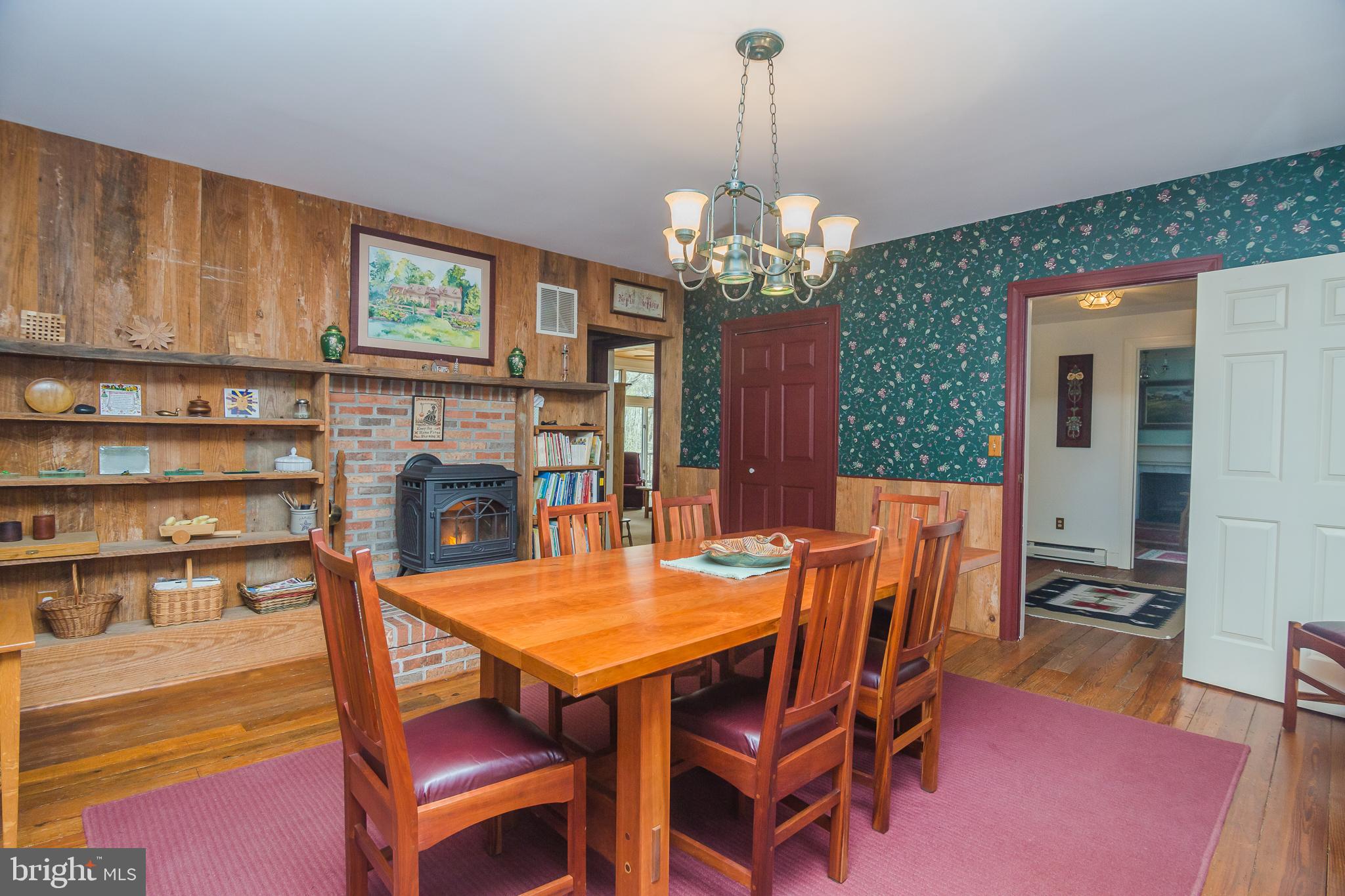 3387 Allen Road Eden, MD 21822 - Photo 16 of 67 a view of a dining room with furniture a chandelier and wooden floor