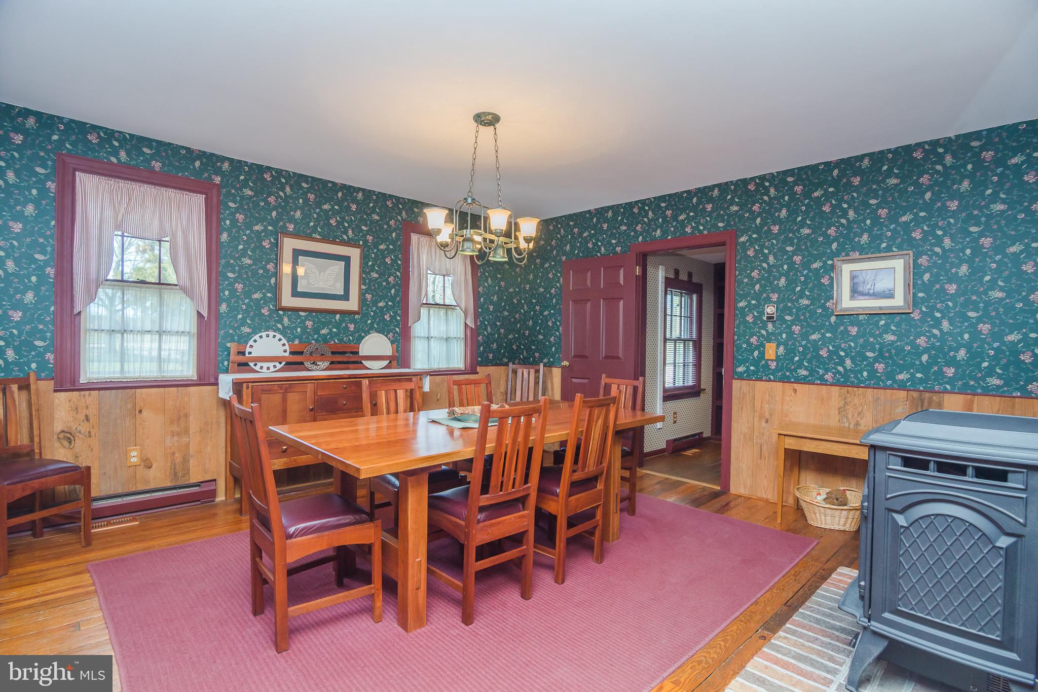 3387 Allen Road Eden, MD 21822 - Photo 18 of 67 a dining room with a wooden table and chairs