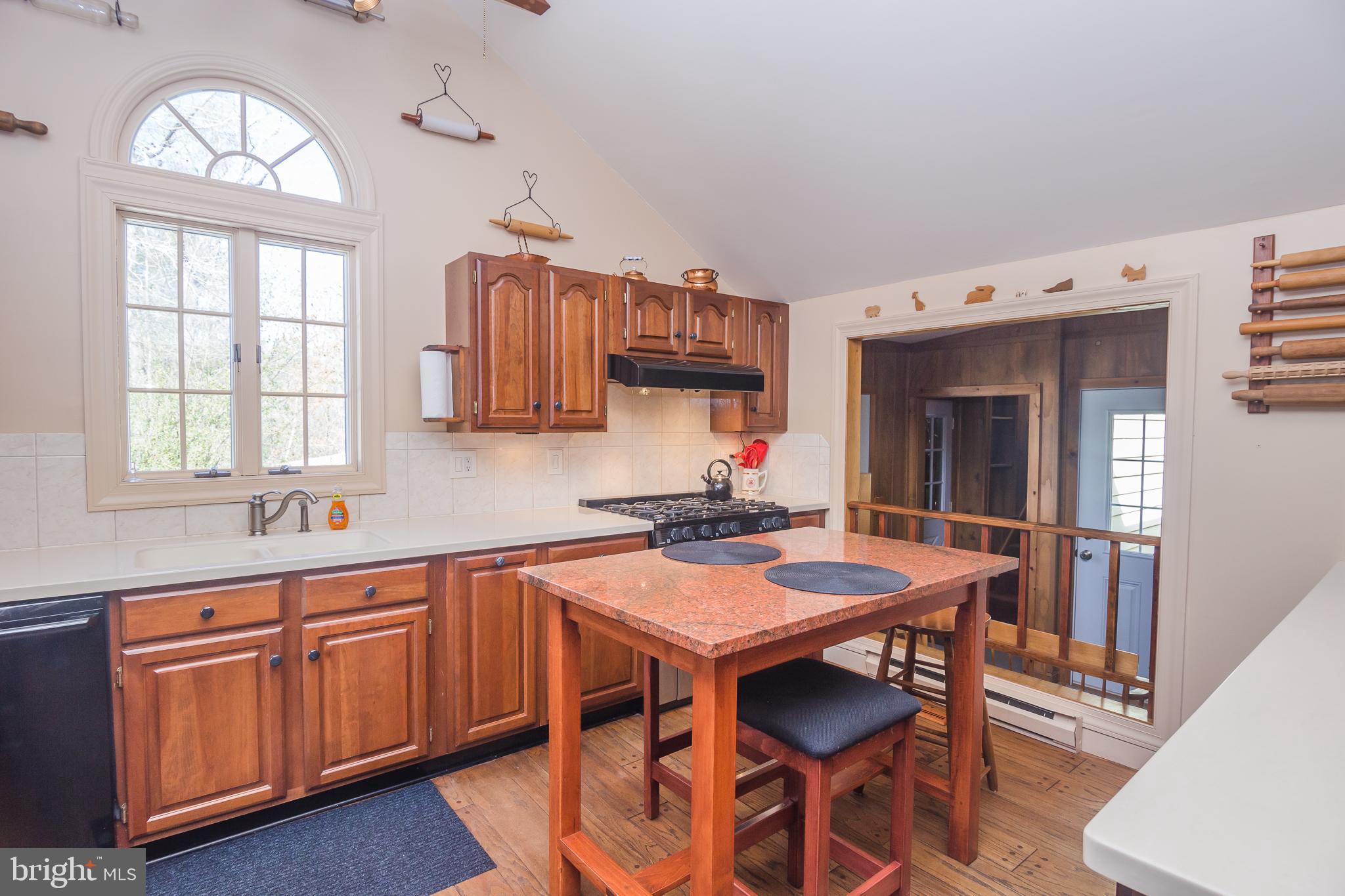 3387 Allen Road Eden, MD 21822 - Photo 21 of 67 a kitchen with a table chairs sink and cabinets
